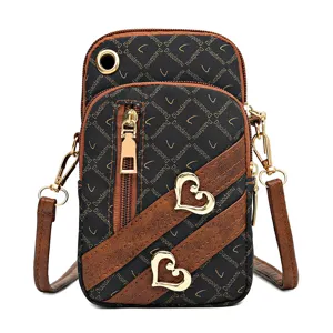 Women vertical mini crossbody phone bag with shoulder strap, card pocket and heart decor.