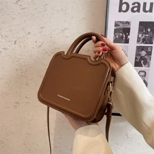 Stylish retro brown shoulder bag for women, PU leather casual handbag with top handle.