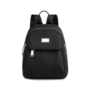 Stylish black nylon mini backpack for women, casual daily travel bag with metal zip.