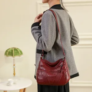 Washed leather cross-body shoulder bag for women, multi-pocket soft daily mom bag style.