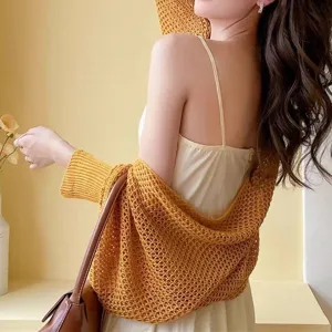 Summer ice silk hollow knitted shawl cardigan, elegant back view office sun-protection outer wear.