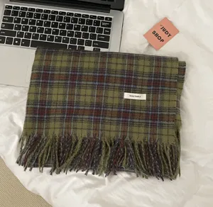 Green plaid winter scarf for women, cozy tassel design, perfect K-style fashion accessory.