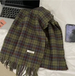 Cozy green plaid winter scarf for women, classic tartan design, soft and warm daily shawl.