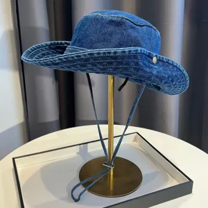 Retro washed blue denim bucket hat with windproof drawstring for outdoor sun protection main view