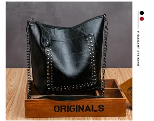 Black soft leather shoulder bag with metal studs and chain strap, stylish daily hobo tote detail.