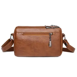 Brown soft leather vintage crossbody bag for women, multi-zipper small square shoulder bag.