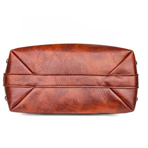 Stylish brown soft leather women's handbag bottom view, durable and elegant design daily use.