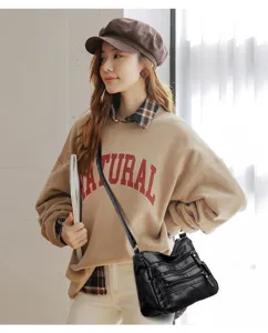 Black multi-zipper soft leather shoulder bag for women, casual large capacity crossbody.