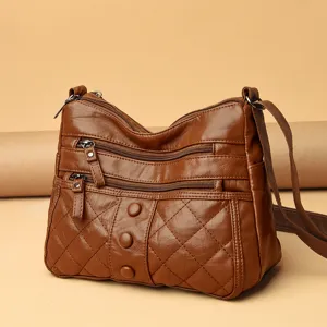 Brown soft leather women shoulder crossbody bag with multiple zippers and quilted design main view
