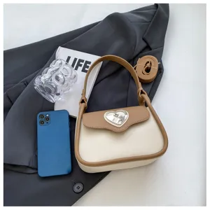Borsa a sella bicolore nicchia francese elegante borsa a tracolla donna dettaglio.