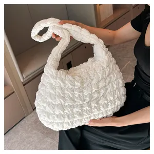 Detailed view of the trendy white quilted shoulder bag, casual padded tote bag with large capacity.