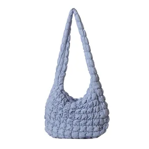 Trendy light blue quilted shoulder bag for women, casual large capacity puffer tote bag.