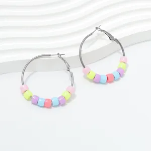Detail view of stylish European and American candy-colored beaded hoop earrings fashion jewelry.