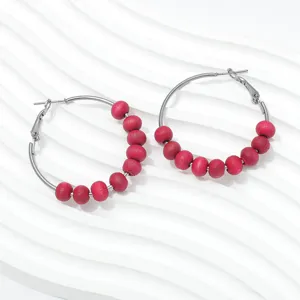 Retro handmade wooden bead hoop earrings for women, stylish minimalist metal circle ear jewelry.
