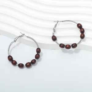 Retro wooden bead hoop earrings featuring stylish design, perfect daily jewelry for women.