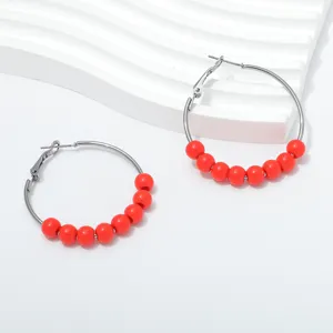 Retro handmade beaded hoop earrings for women, stylish 4cm metallic circle jewelry item.
