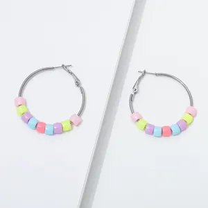 Closeup detail of colorful candy beaded hoop earrings, stylish and sweet design for daily wear.