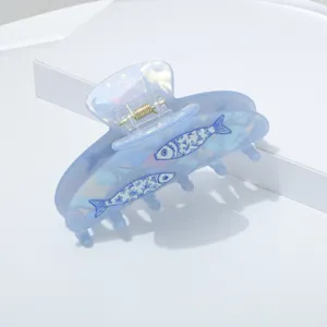 Blue pearl acrylic hair claw clip with cute fish print, stylish summer hair accessory for women.
