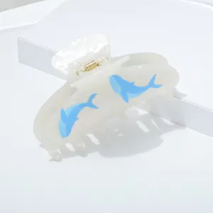 Whale print hair claw clip detail, translucent white acrylic hairpin, summer fashion accessory.