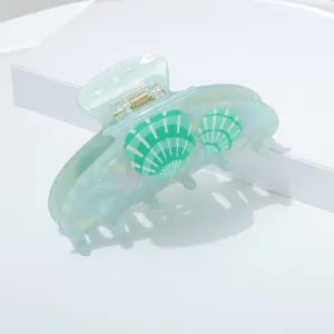 Mint green seashell acrylic hair claw clip for summer style, cute and elegant daily hair accessory.