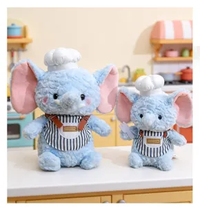 Adorabili peluche di elefante blu con cappelli da cuoco e grembiuli a righe come decorazione.