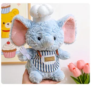 Peluche elefante blu bambola chef con grembiule carino e cappello da cuoco, morbido animale di peluche.