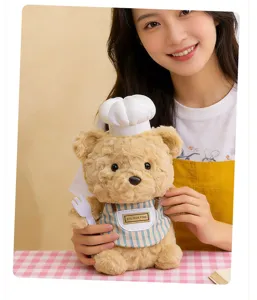 Simpatico peluche orsetto con cappello da cuoco e grembiule, morbida bambola per la scrivania.