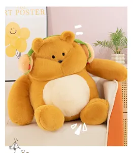 Cute chubby brown plush toy with burger headphones, soft healing doll for room decor.