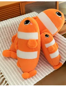 Cute clownfish plush pillow detail view, soft stuffed marine animal toy for cozy home decor.