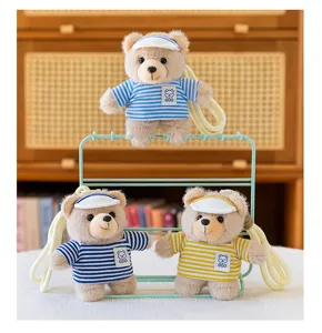 Detailed view of cute striped plush bear keychain pendants, soft toy accessories for bags and keys.