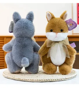 Detail view of cute plush rabbit toys with elegant bowknot, perfect stuffed animal gift.