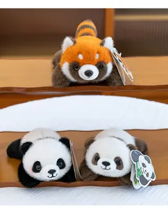 Cute cartoon animal red panda and giant panda plush toys detail view, soft stuffed gifts.