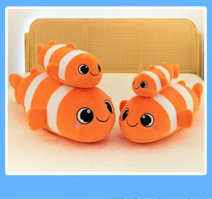 Cute clownfish plush toy detail view, soft stuffed marine animal pillow for room decor.