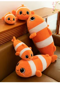 Cute clownfish plush toy pillow, soft stuffed marine animal doll for home decor and sleep.