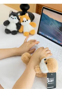Cute plush cat doll wrist rest for keyboard and desk decor, soft fluffy animal plushie detail view.
