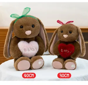 Cute long eared bunny plush toy holding heart, soft comforting doll and birthday gift for girls