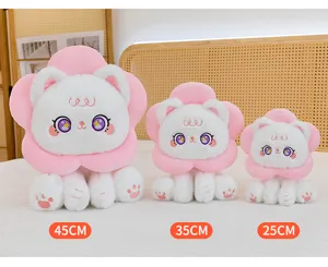 Detail view of cute sunflower cat plush toy with pink flower collar and big sparkly eyes.