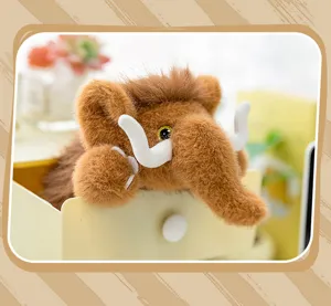 Cute woolly mammoth plush toy detail shot, soft stuffed animal doll with cute tusks and brown fur.