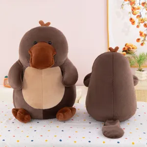 Cute plush platypus stuffed animal toy, soft brown squatting doll pillow for home decor gift.