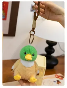 Close-up detail of the cute duck plush toy keychain pendant showing soft texture and metal clasp.