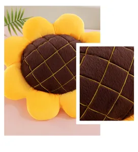 Close-up detail of the cute sunflower plush cushion showing soft brown grid texture and petals.