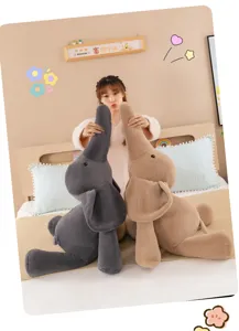 Cute elephant plush toy detail showing soft stuffed animal pillow and bedside companion design.