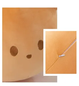 Close up view of cute brown plush bear pillow showing soft fabric, embroidery and zipper.