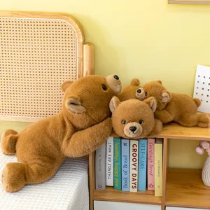 Simpatico orsetto marrone di peluche sdraiato morbido animale cuscino bambola regalo
