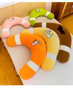 Cute U-shaped plush body pillow for pregnant women, soft hugging pillow for comfortable sleeping.