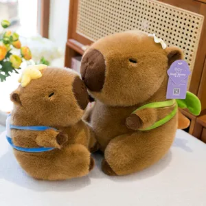 Lindos juguetes de peluche de carpincho juego con flor y anillo natación muñecos peluche.