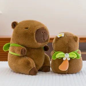 Adorable peluche de capibara con flotador de hoja, muñeco de tela suave para decoracion.