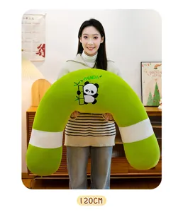 Detailed view of the soft green U-shaped hugging pillow with cute panda design for cozy sleep.