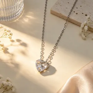 Close-up detail shot of sparkling heart crystal necklace on a warm aesthetic background showcase.