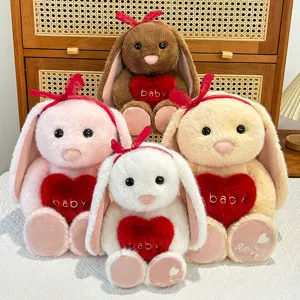 Cute long ear plush rabbit doll with red heart pillow, soft stuffed animal toy for kids.